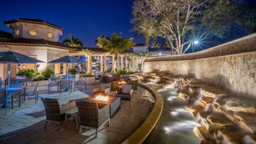 outdoor bistro seating with fire pits and water fountain feature