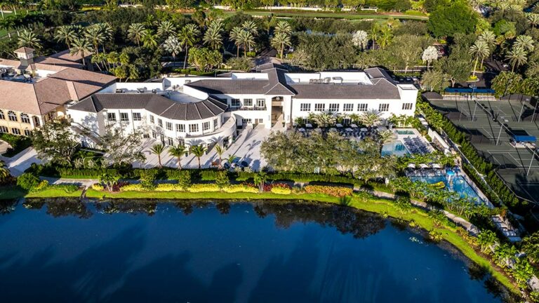 aerial view mizner country club with water and building